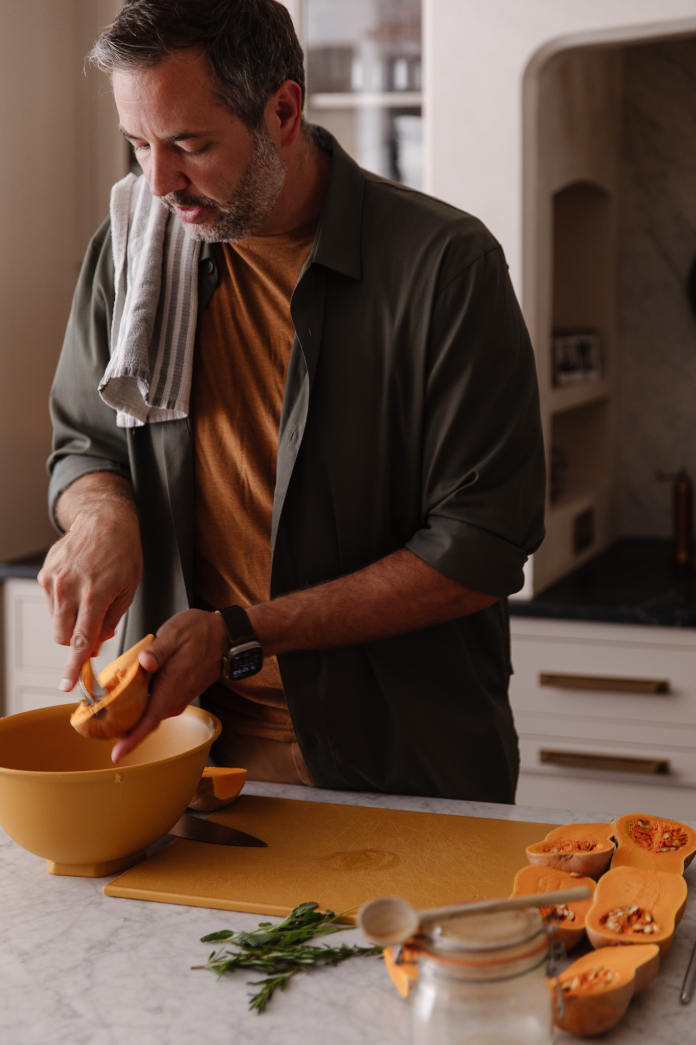 Chris cleaning honeynut squash seeds and pulp