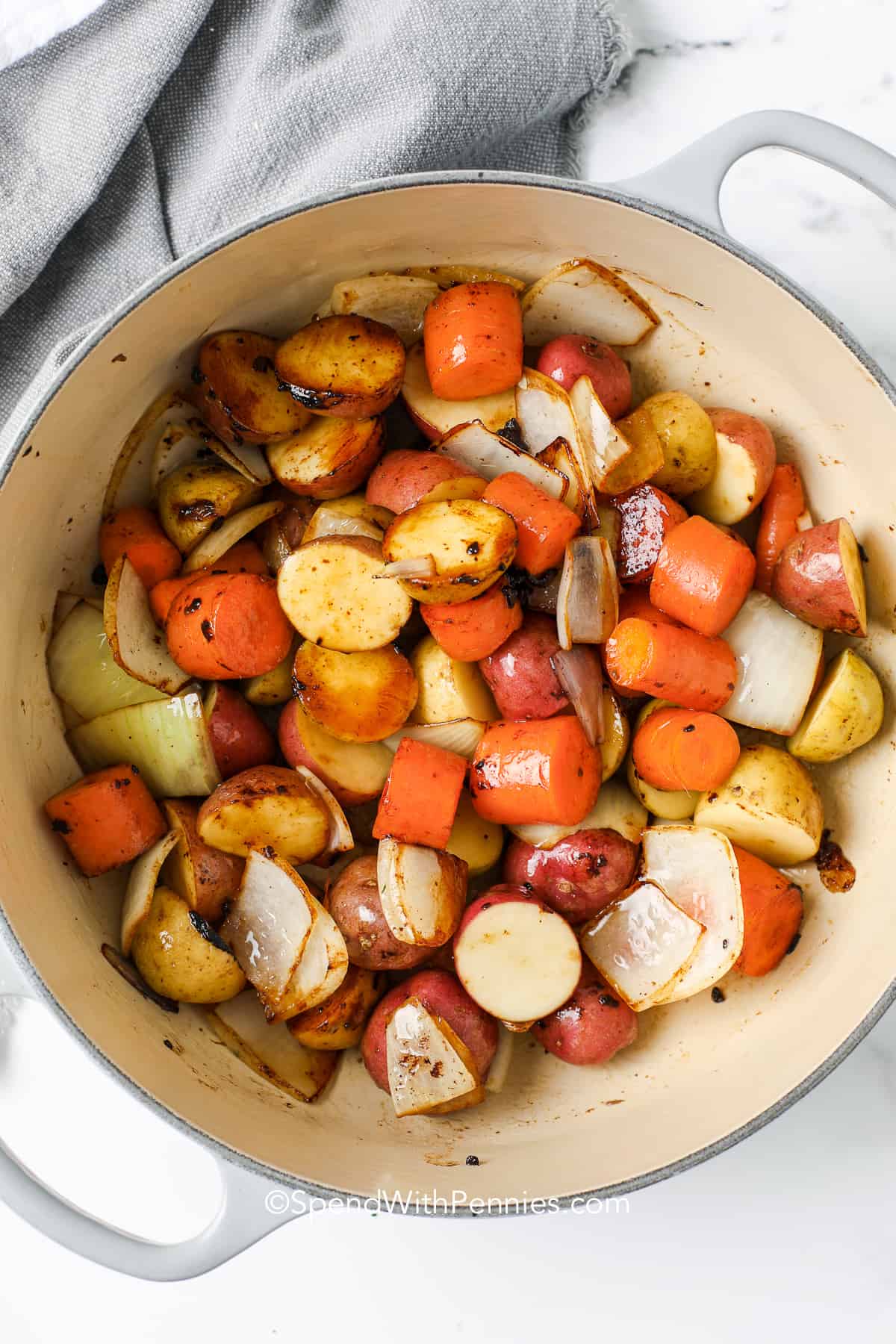 vegetables to make Beef Bourguignon being cooked in a pan