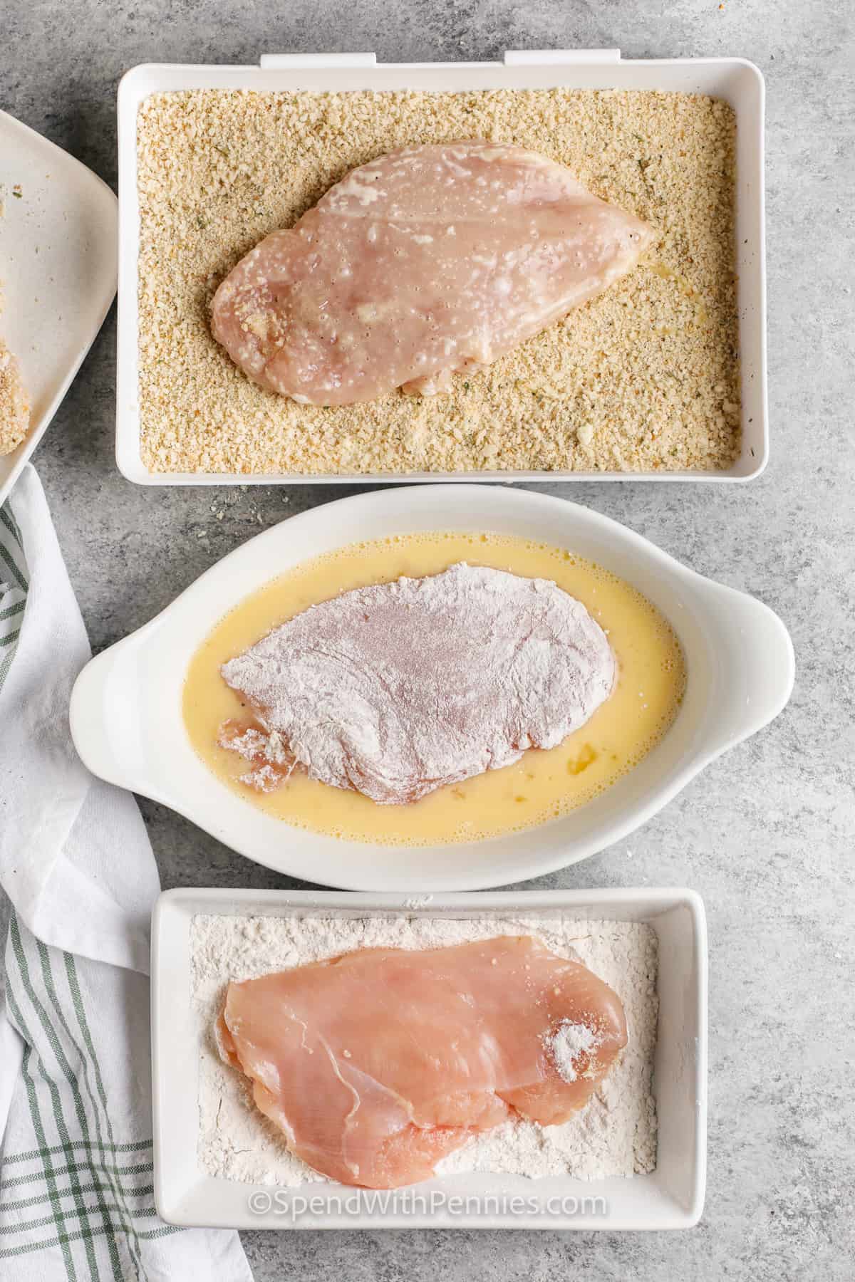 Craving something delicious? Try this easy chicken parmesan recipe. With crispy breaded chicken breasts, marinara sauce, and gooey melted cheese, it’s a family favorite. Preheat the oven, coat and brown the chicken, then bake with marinara and cheese until bubbly. Serve over pasta with a garnish of fresh basil and parsley. Perfect for a weeknight meal or special occasion. #spendwithpennies breading chicken to make Easy Chicken Parmesan
