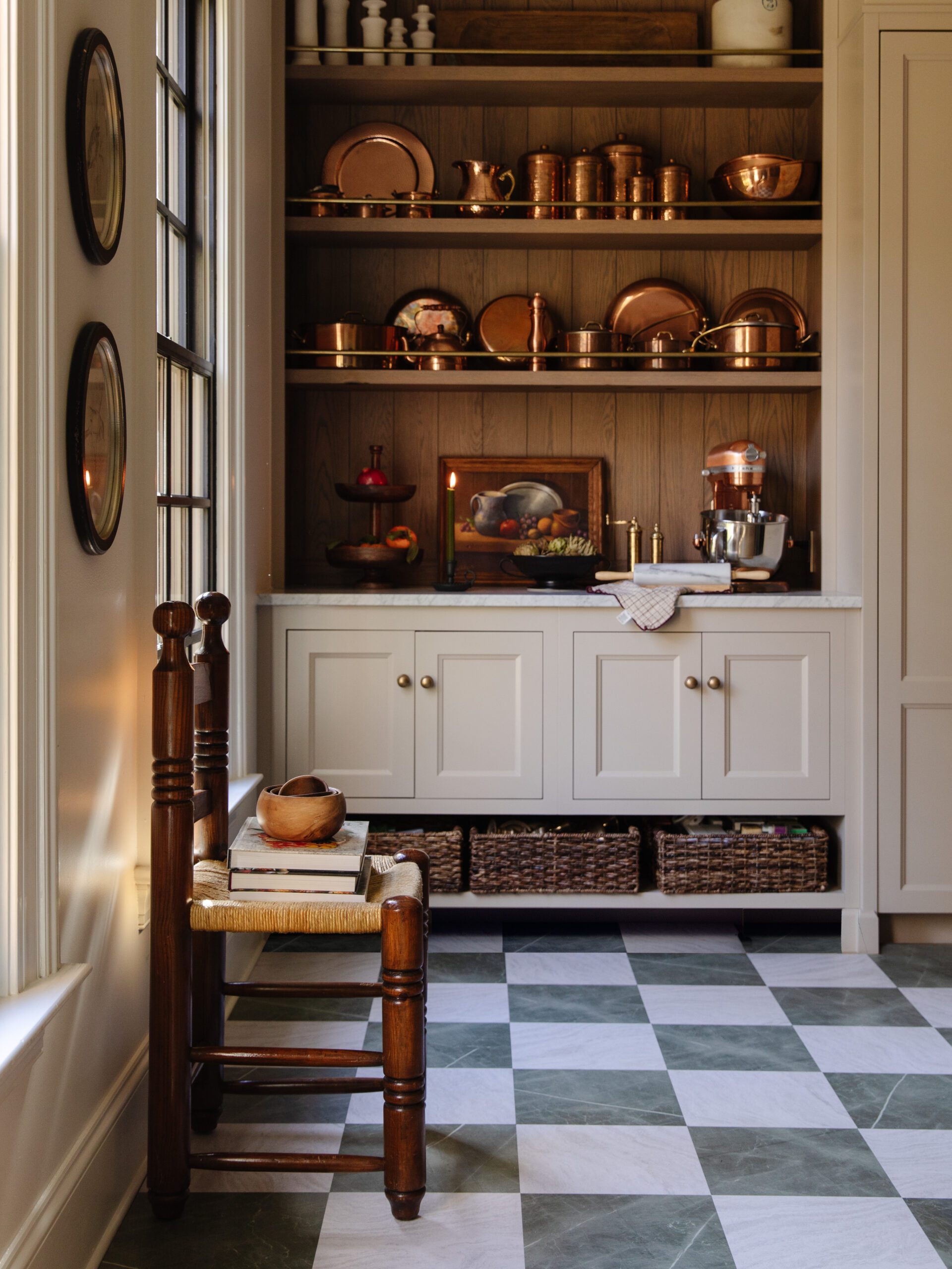 A modern kitchen with a floor pattern of green & white marble checkerboard