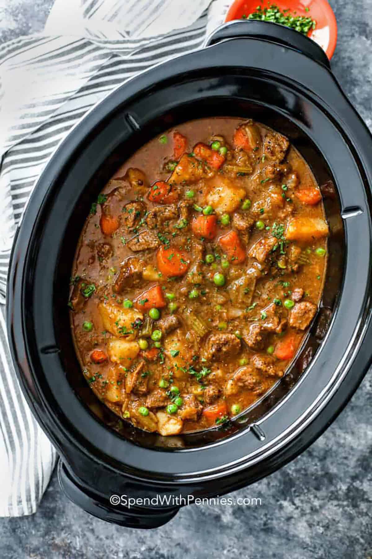 Crockpot beef stew is everything you love about comfort food—rich, hearty, and so satisfying. Juicy beef, tender potatoes, and veggies are cooked low and slow for unbeatable flavor. It’s easy to make and even easier to love! Whip up this classic dish for a cozy dinner everyone will rave about. Plus, the leftovers are a lifesaver on busy days. #spendwithpennies crock pot filled with Crockpot Beef Stew