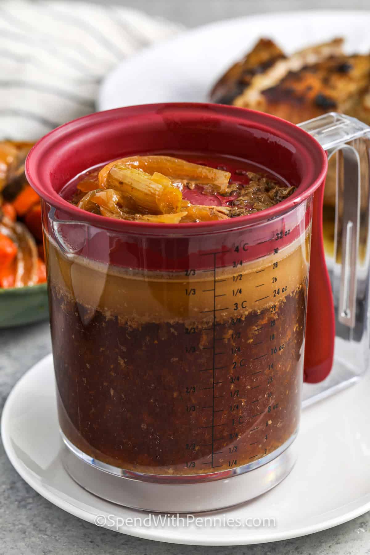 gravy in a measuring cup for Crock Pot Pork Roast