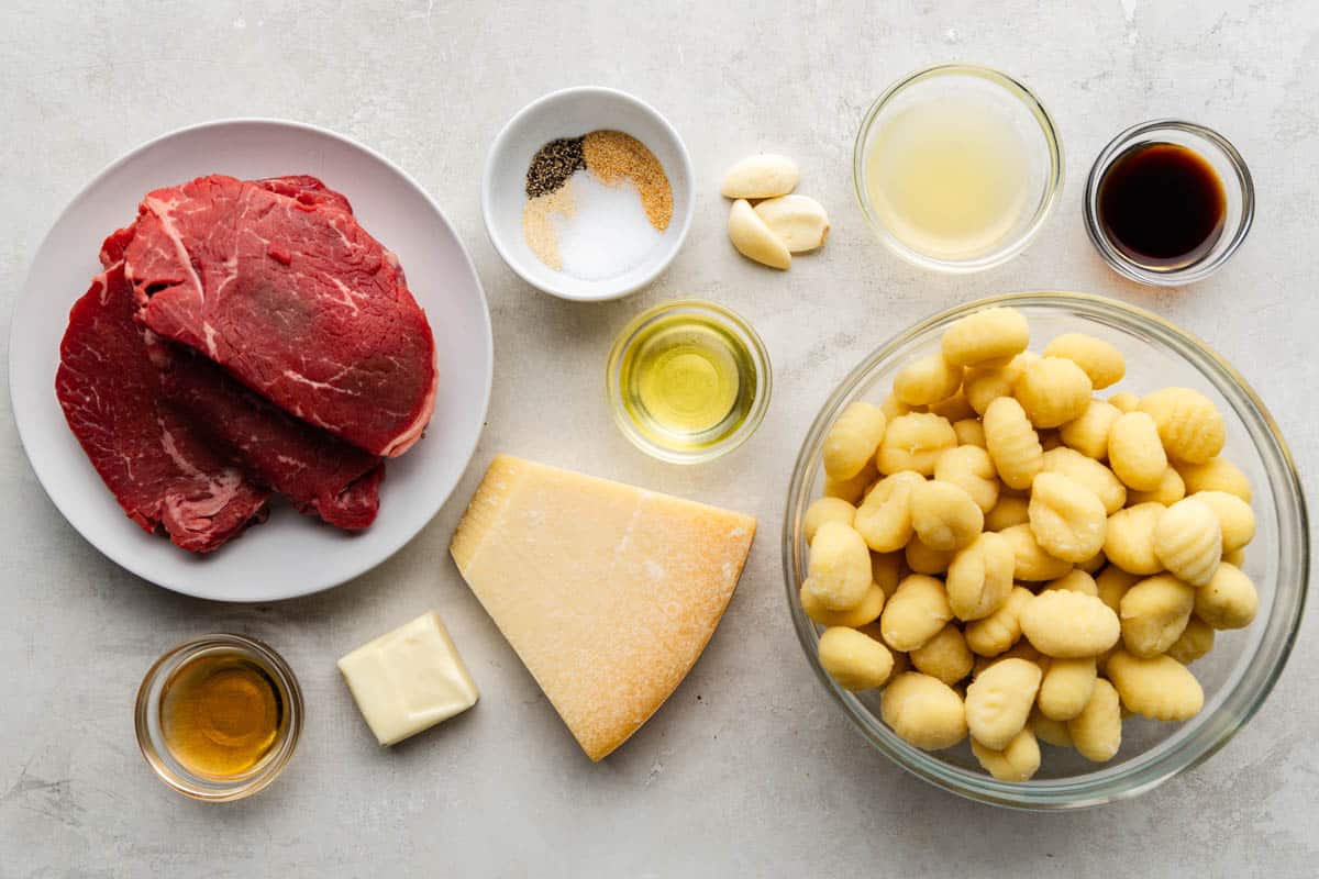 An overhead view of the ingredients needed to make air fryer steak bites and gnocchi.