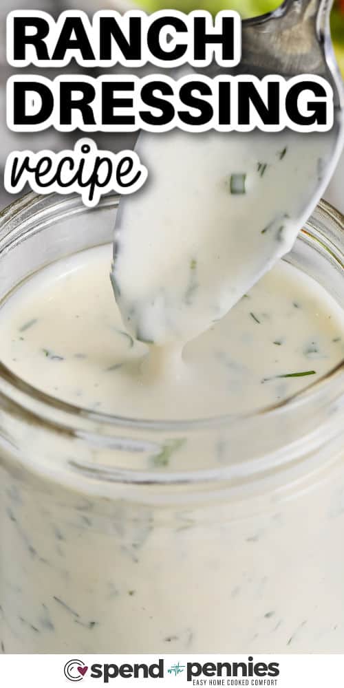 taking a spoonfull of Ranch Dressing Recipe out of the jar with a title