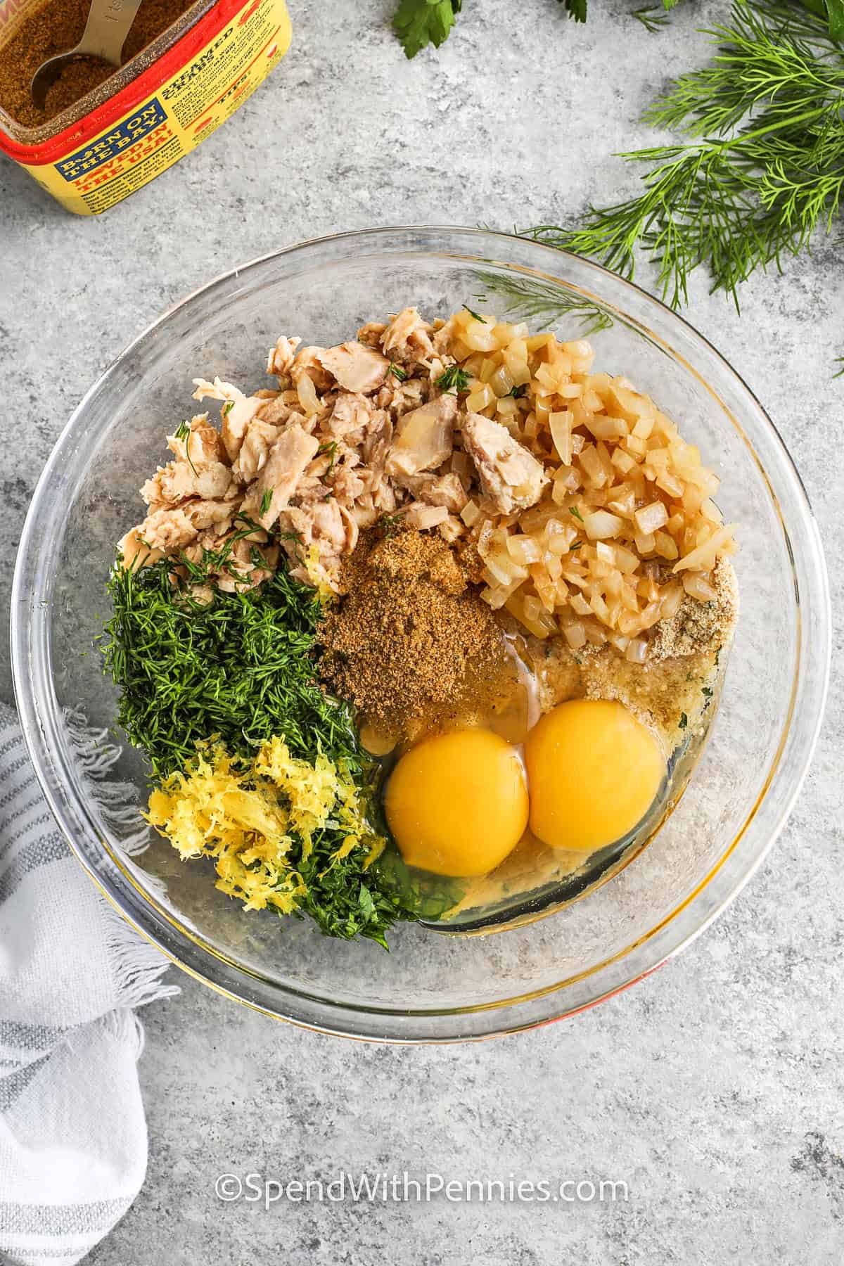 adding ingredients together in bowl to make Salmon Patties