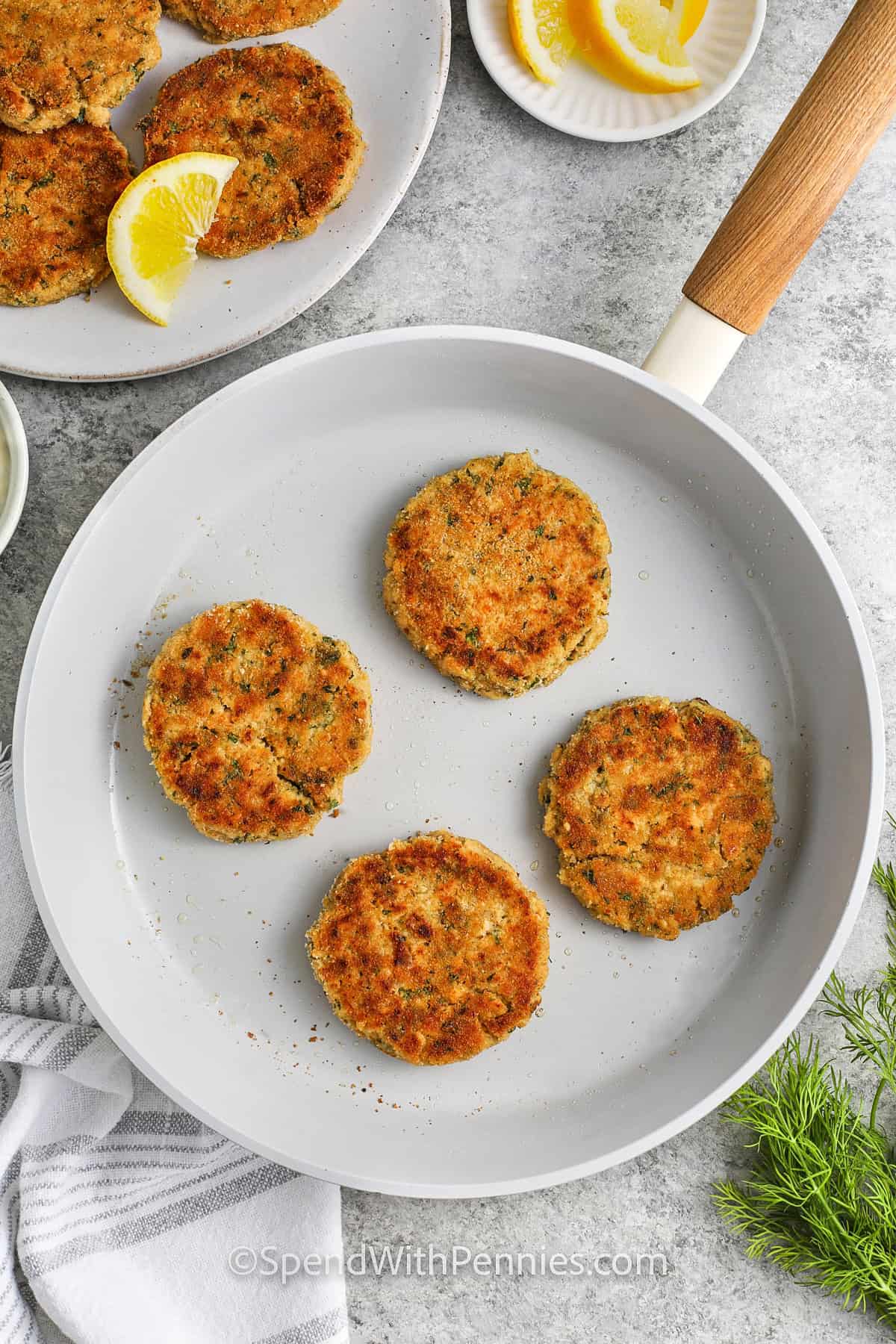 Salmon Patties cooking in a pan