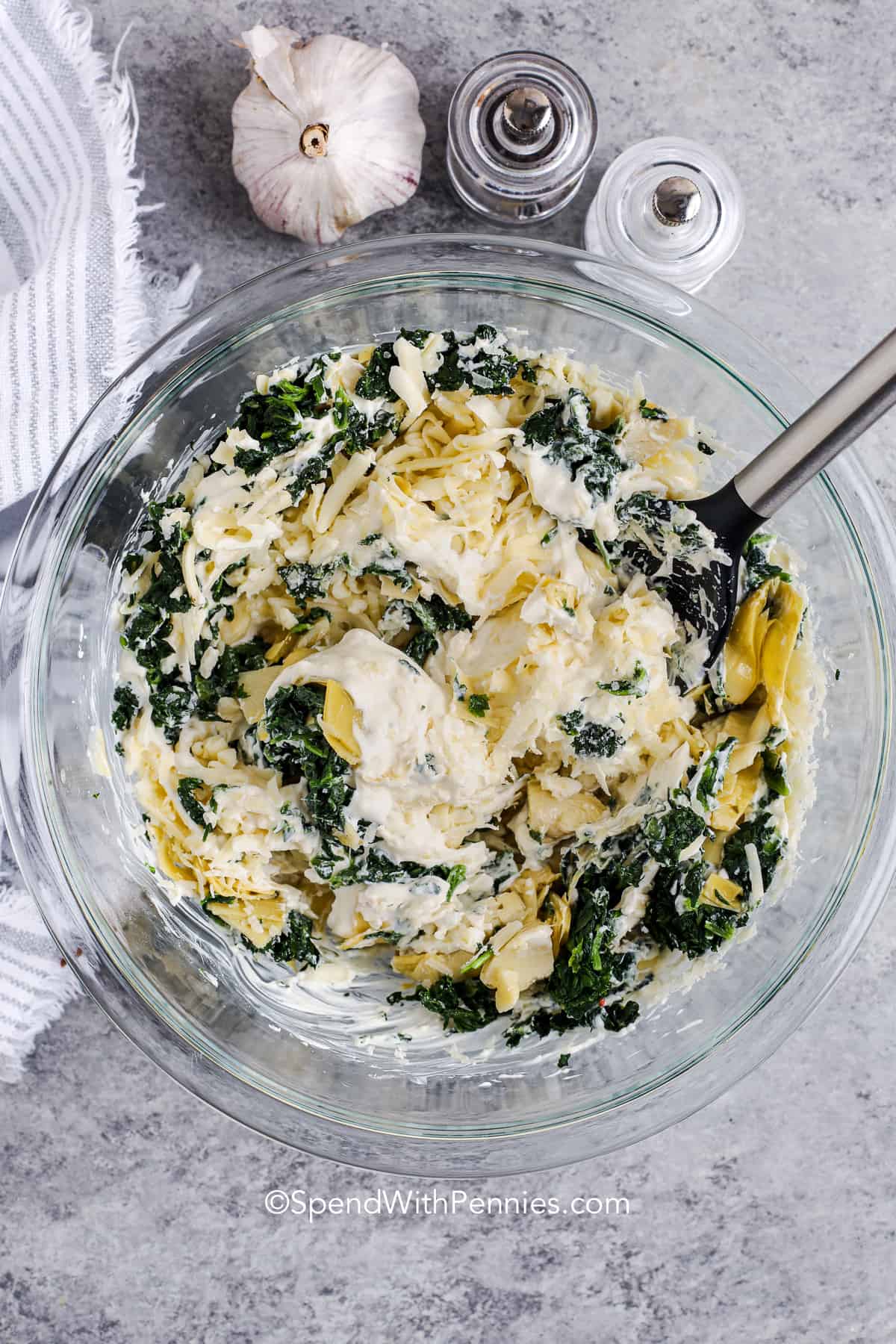 mixing Spinach Artichoke Dip ingredients together