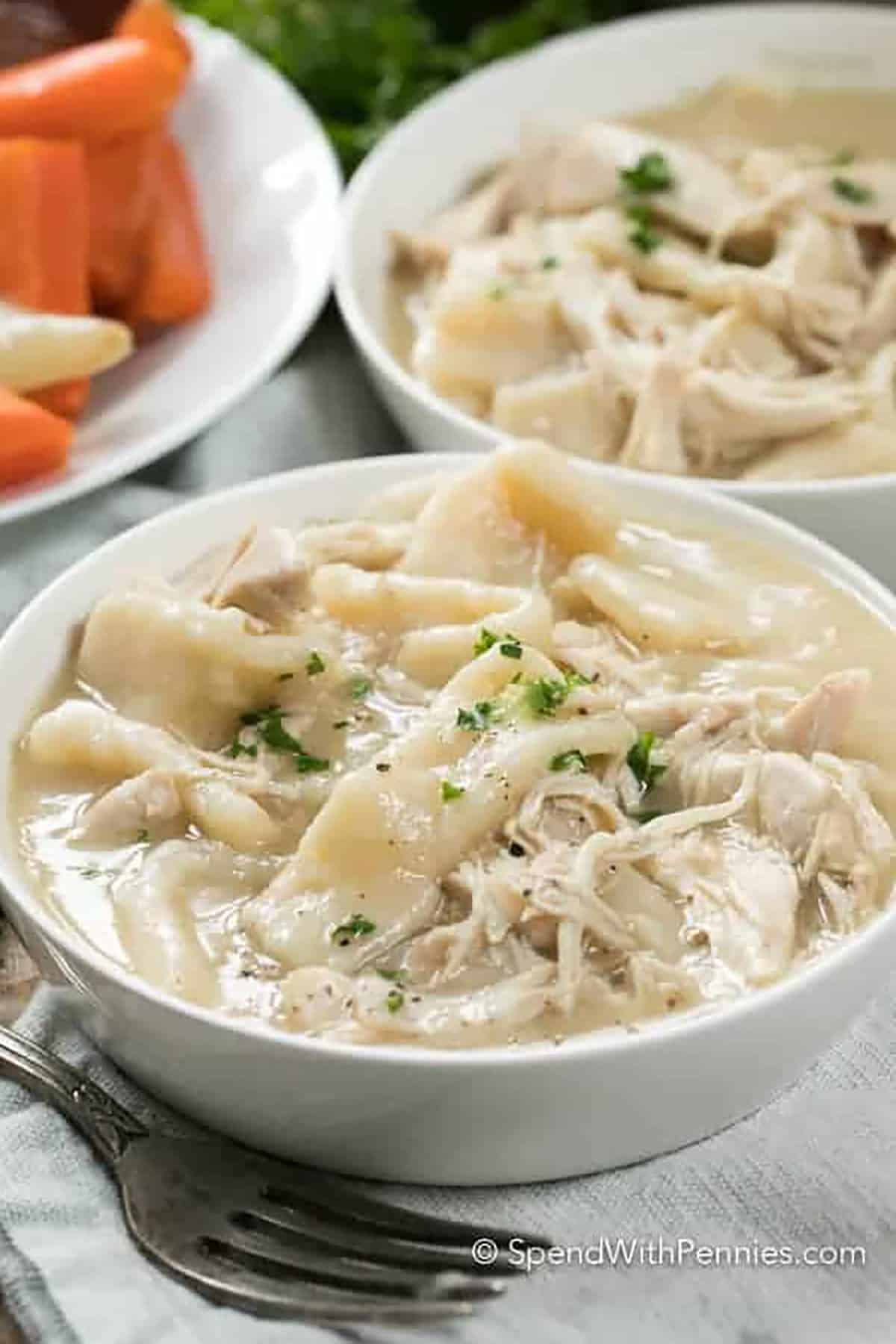 close up of easy Old Fashioned Chicken and Dumplings in bowls