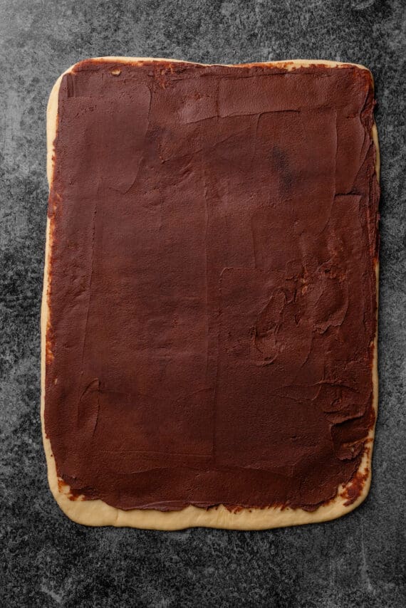 A large dough rectangle topped with chocolate filling.