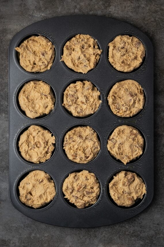 Milky Way cookie dough pressed into a muffin top pan.