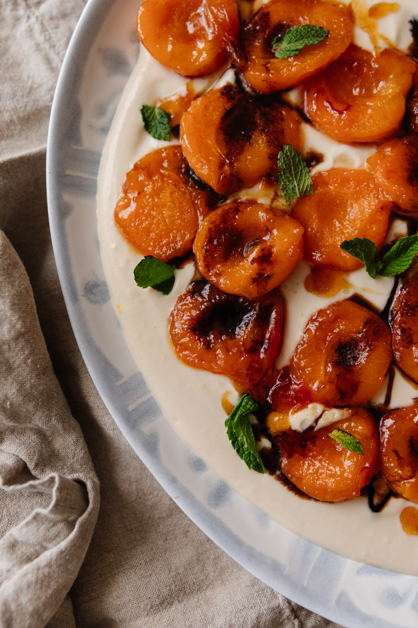 Close-up of caramelized apricots over a whipped ricotta cream
