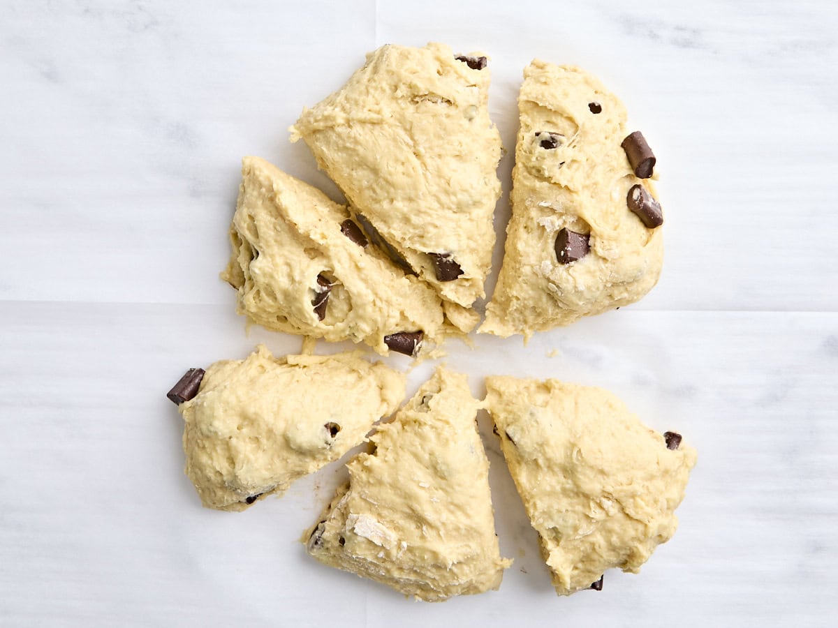 Sourdough chocolate chunk scone dough divided into 6 pieces.