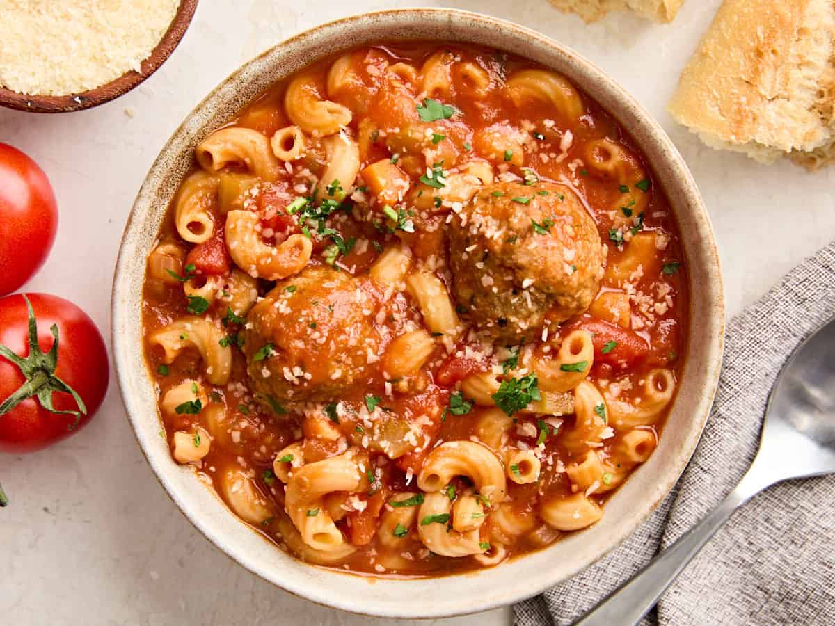 Overhead view of a bowl of hearty meatball soup.