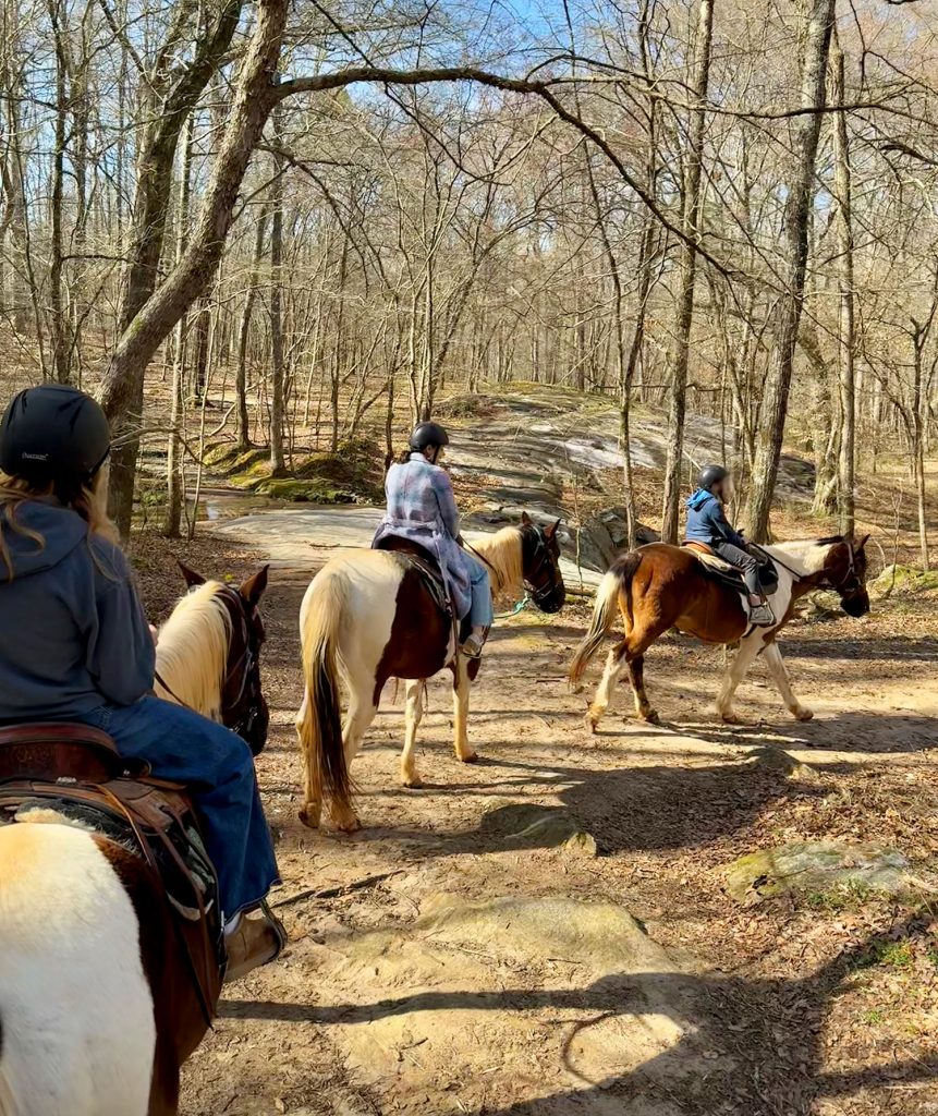 Riding Horses Through Woods of Serenbe Georgia